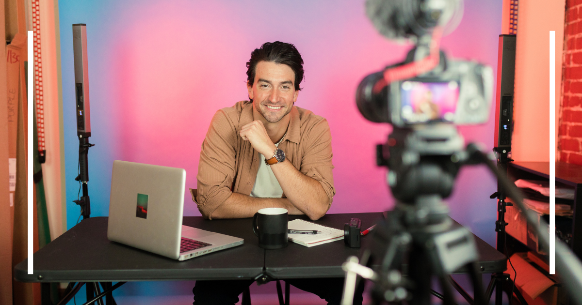 A creator setting up a YouTube channel with a laptop, camera, and New Year decorations in the background.